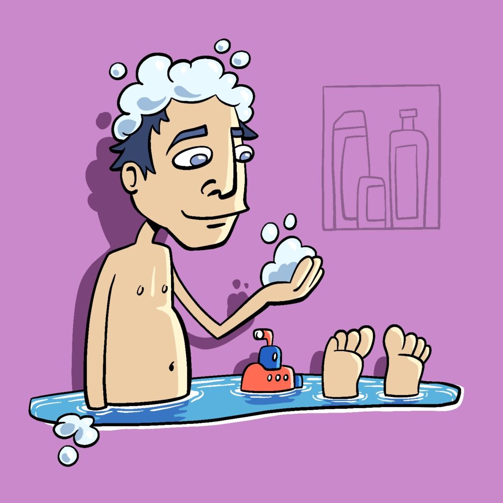 An illustration of a man taking a bath. The bathwater is the only part of the bath that is visible. The man is sitting in the bath, looking down at his hand, which is holding some bubbles. His feet are sticking out at the other end of the water. The man has a light complexion, and his hair is a dark blue and covered in bubbles. There is a small red and blue toy submarine floating in the water between the man and his feet. The bathwater is blue with darker blue reflections and white rippled in it. The background is a light purple, with outlines of an inset with shampoos and soaps to the upper right.