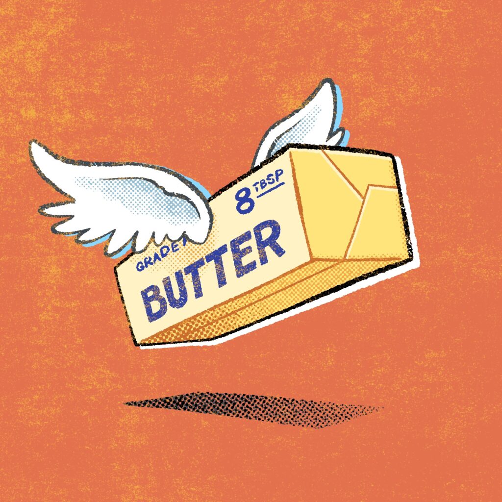 An illustration of a stick of butter with wings on each side, lifting off the ground. The butter is yellow and says, "grade a", "8 tbsp", and "butter" in large blue letters on the side. You can see the fold marks for the wrapper. The wings are white, spread out, and look fluffy. The stick is barely off the ground, as indicated by a shadow not far below it. The background is a red orange color and the entire image has a distressed yellow noise applied.